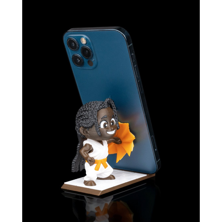 Support Téléphone Figurine Punchline – Le Karatéka Qui Tient Votre Phone