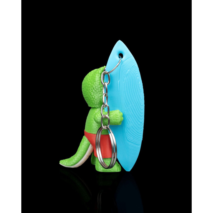 Tyrannosurf – Porte-Clés Dinosaure Surfeur